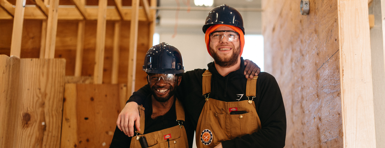 two apprentices smiling