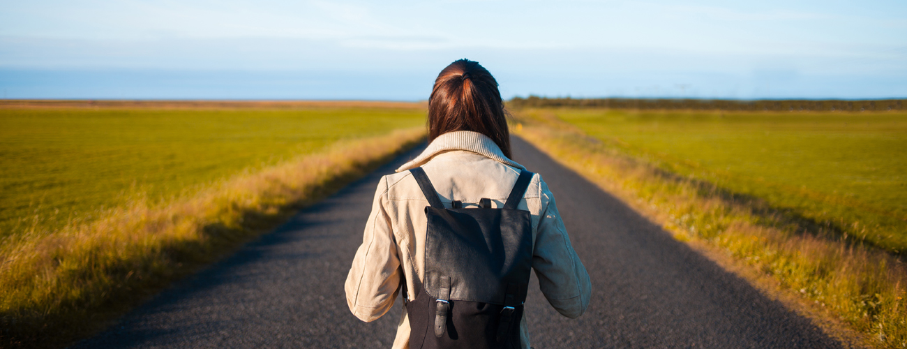 woman walking on road