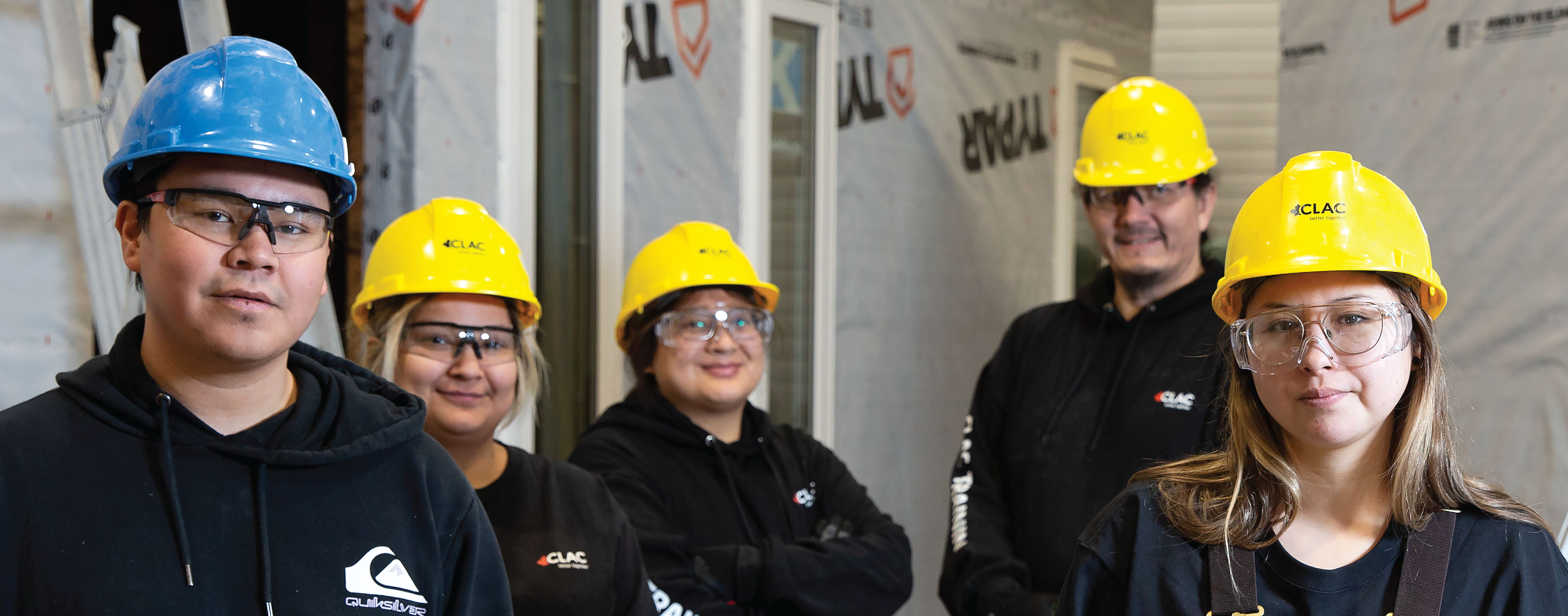 five students in hard hats