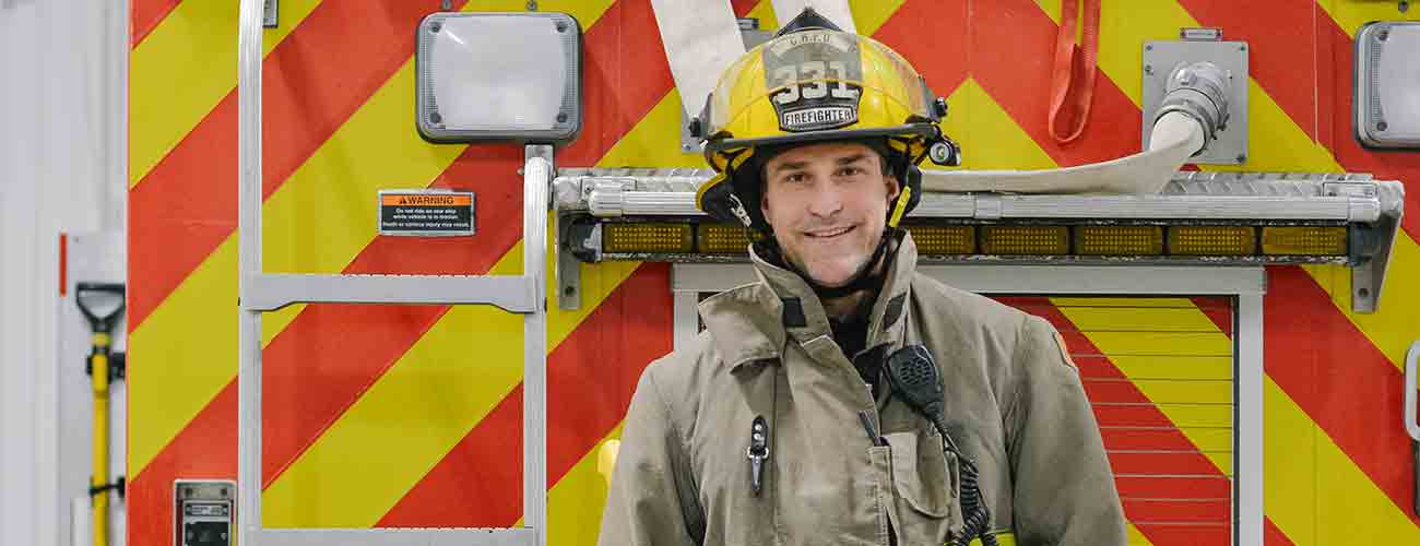 fireman in front of truck