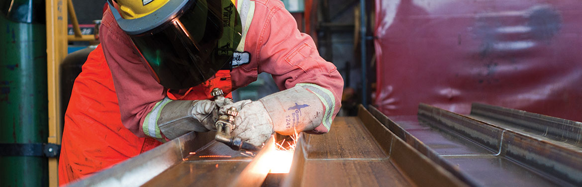 A women welding in a welding shop