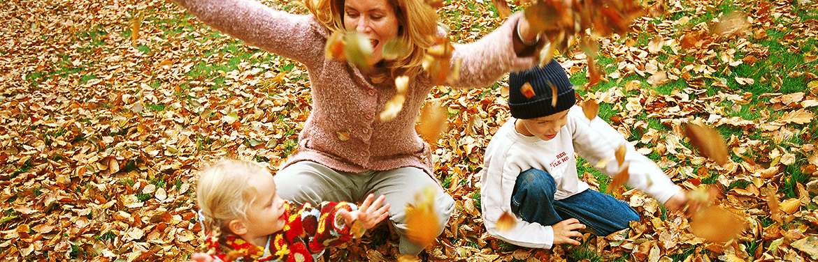 Playing in leaves with children