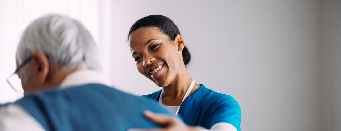 healthcare worker helping a patient